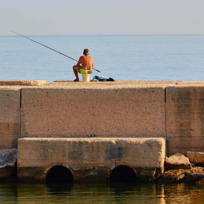 Fishing from pier Molfetta Apulia Puglia Italy